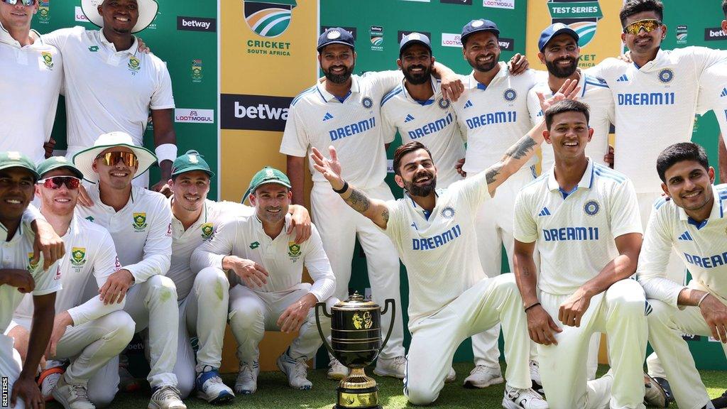 South Africa and India players with the Test series trophy after the drawn series