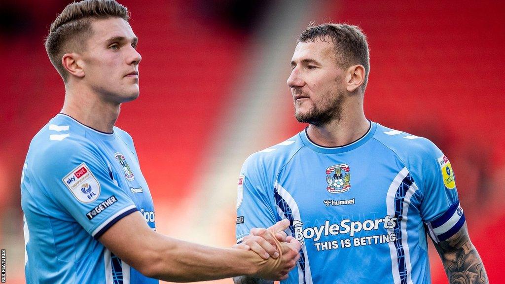 Coventry City's Viktor Gyokores (left) and Kyle McFadzean (right)