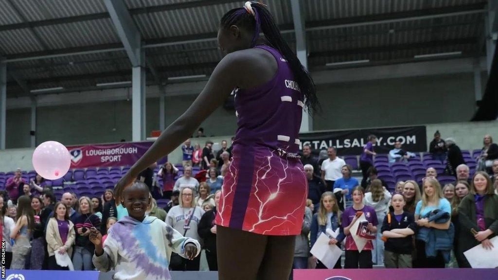 Mary Cholhok for Loughborough Lightning, hugs her son at the end of a game