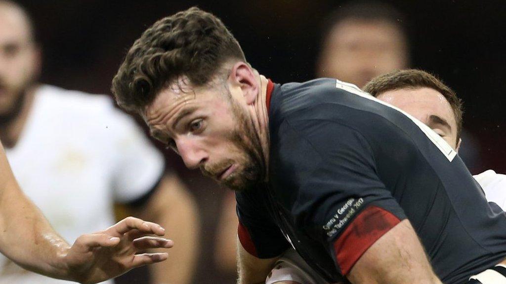 Alex Cuthbert is held against Georgia in November, 2017