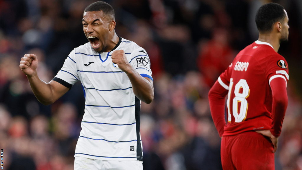 Atalanta's Isak Hien celebrates at the final whistle after his team beat Liverpool at Anfield in the Europa League