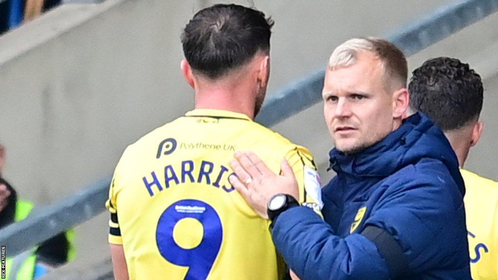 Oxford United manager Liam Manning on the touchline during a League One match.