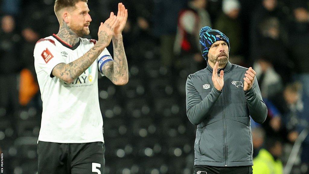 Derby boss Paul Warne (right) and Rams player Sonny Bradley applaud the club's fans for their support after their FA Cup first-round exit