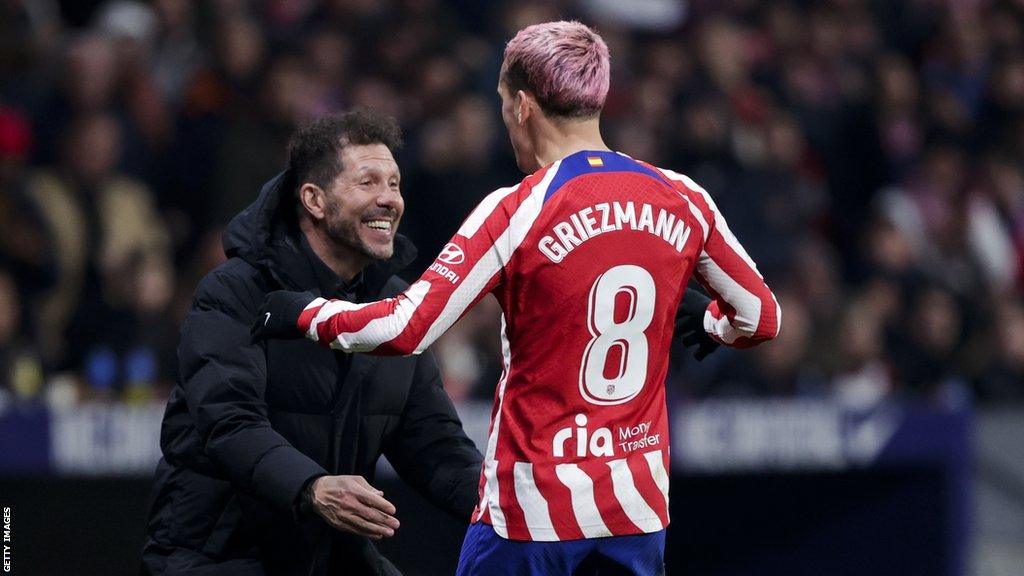 Antoine Griezmann runs to embrace manager Diego Simeone