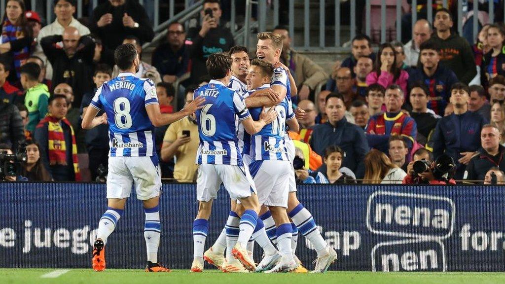 Real Sociedad players celebrate their opening goal against Barcelona