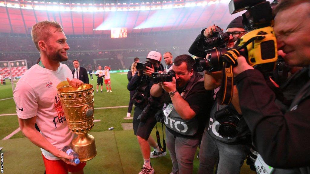 Konrad Laimer celebrates with the German Cup