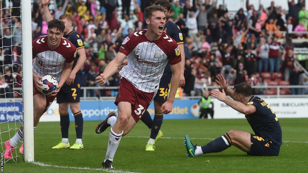 Max Dyche celebrates scoring for Northampton Town