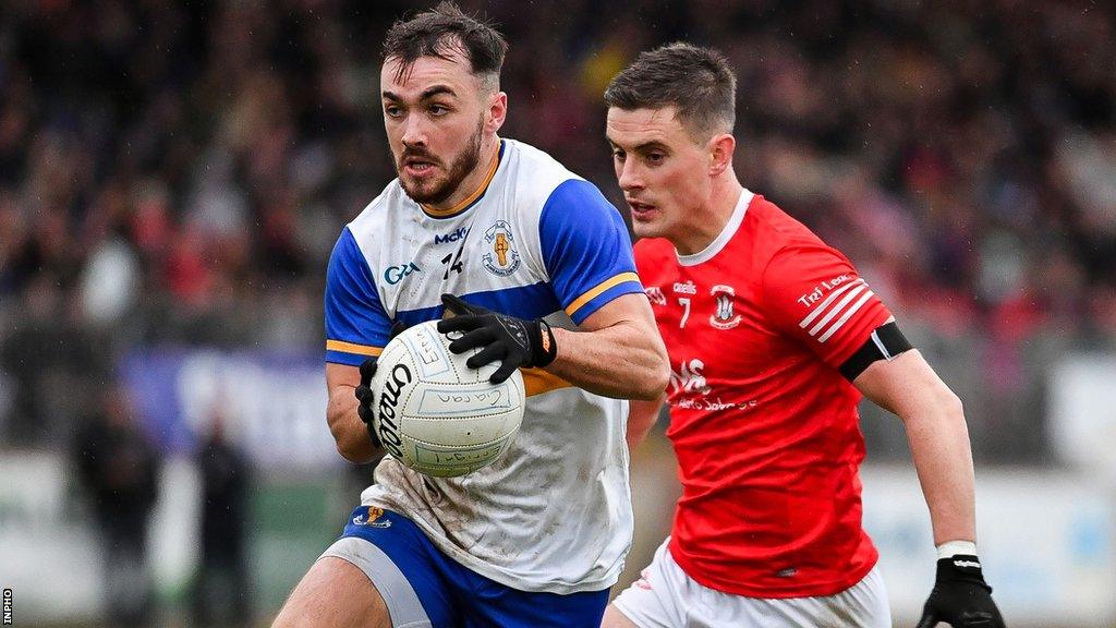 Errigal Ciaran's star forward Darragh Canavan is chased by Trillick's Daire Gallagher