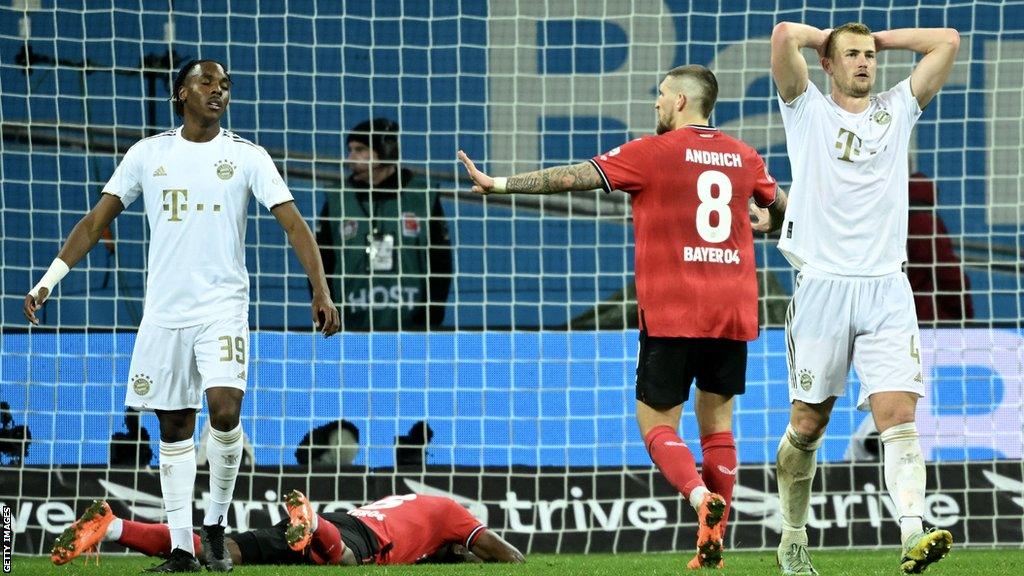 Bayern players look dejected after Exequiel Palacios scores penalty