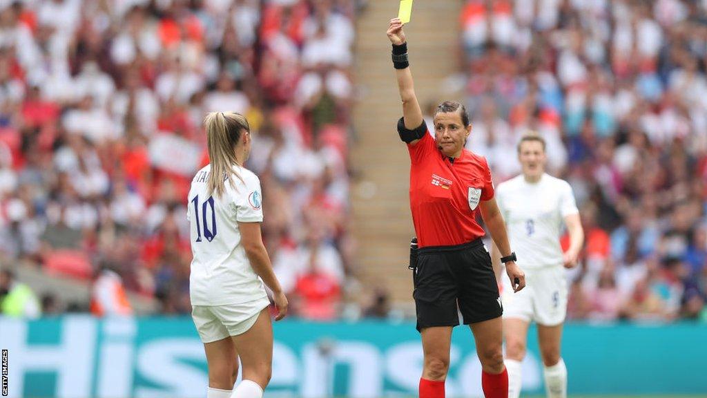 Georgia Stanway is shown a yellow card during the Euro 2022 final
