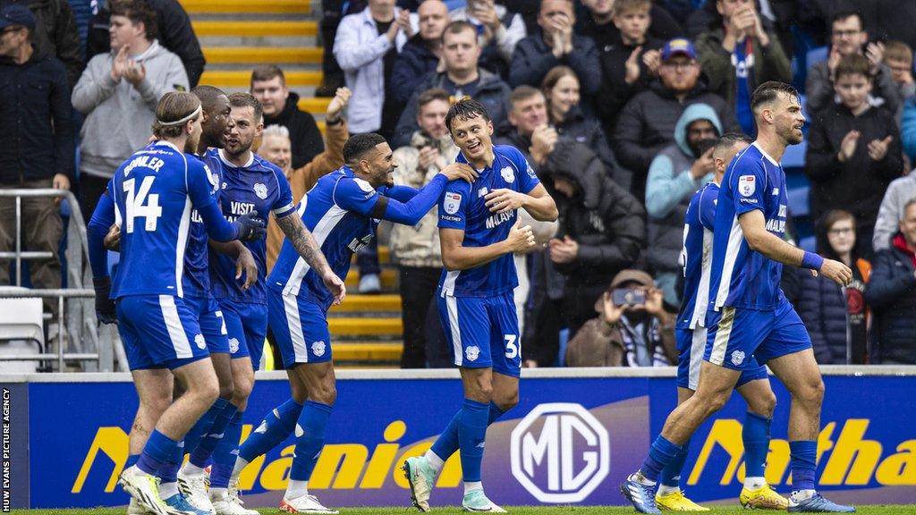 Perry Ng of Cardiff City celebrates his goal with his team-mates