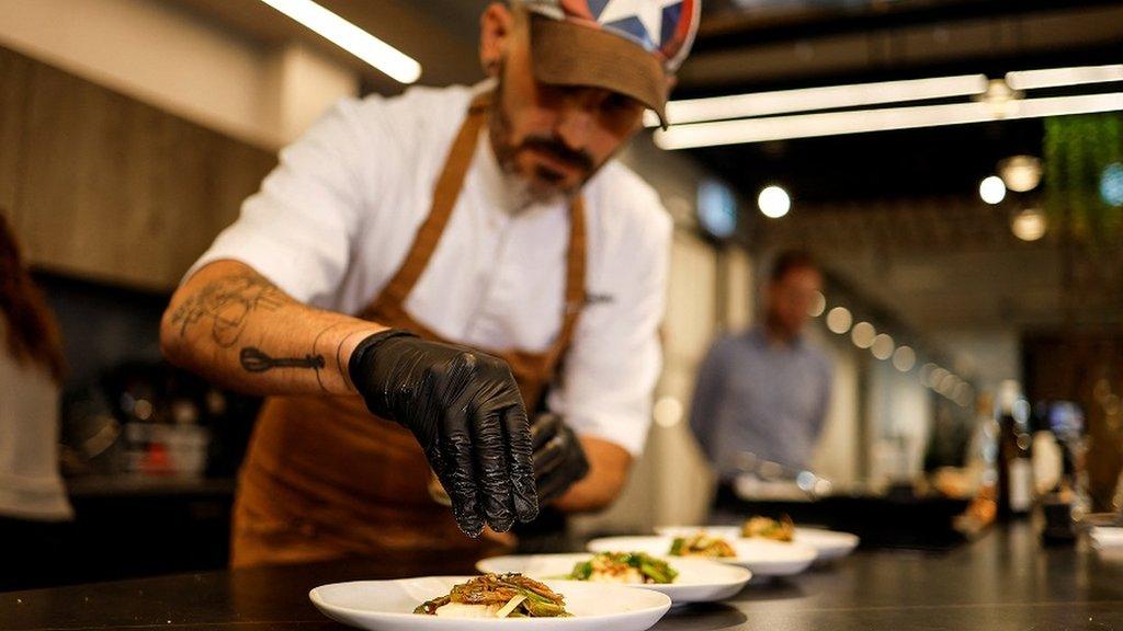 man-plating-up-food.