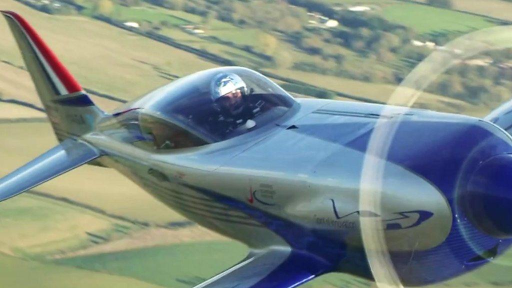 A pilot flies an electric Rolls-Royce plane