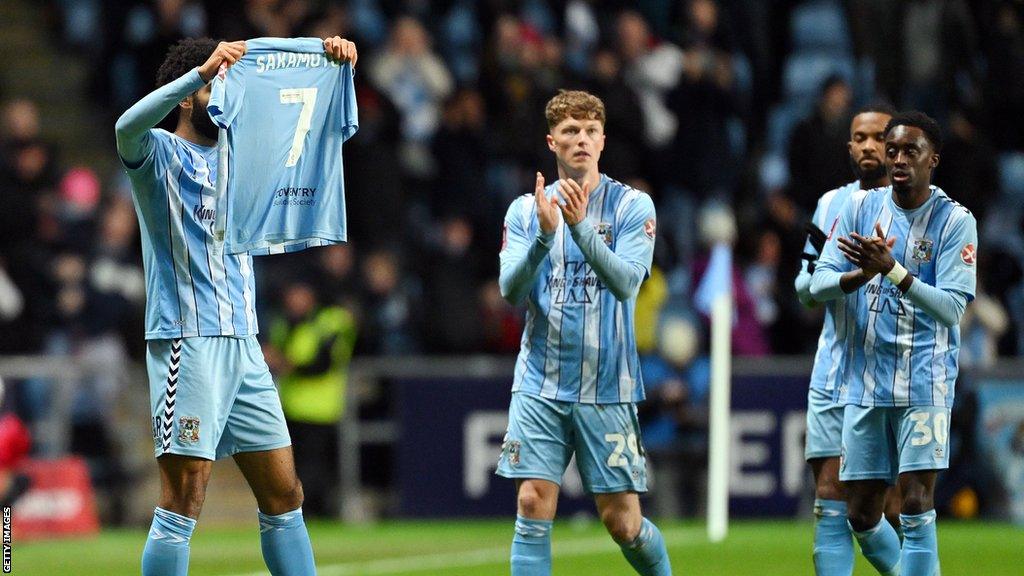 Ellis Simms holds up Tatsuhiro Sakamoto's shirt after scoring against Maidstone