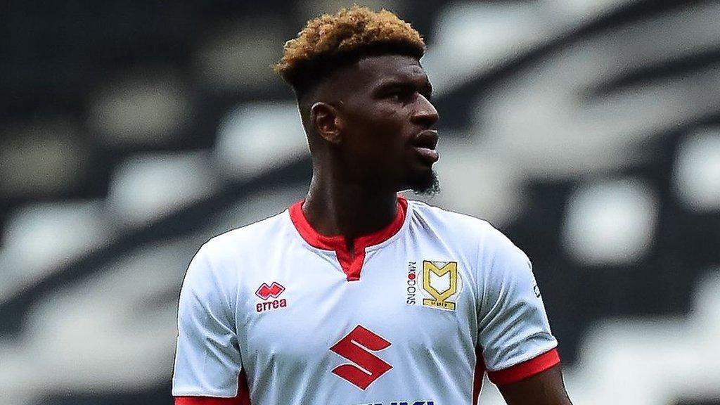 Aston Villa's Aaron Tshibola in action for MK Dons