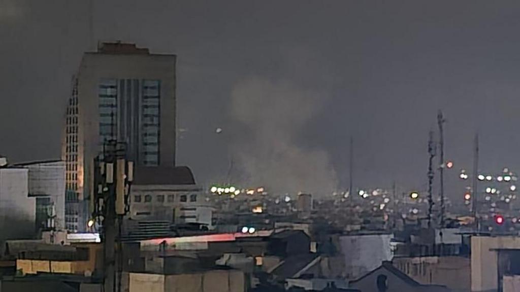 A view shows explosions lighting up the skyline amid ongoing US-Israel attacks in Tehran, Iran.