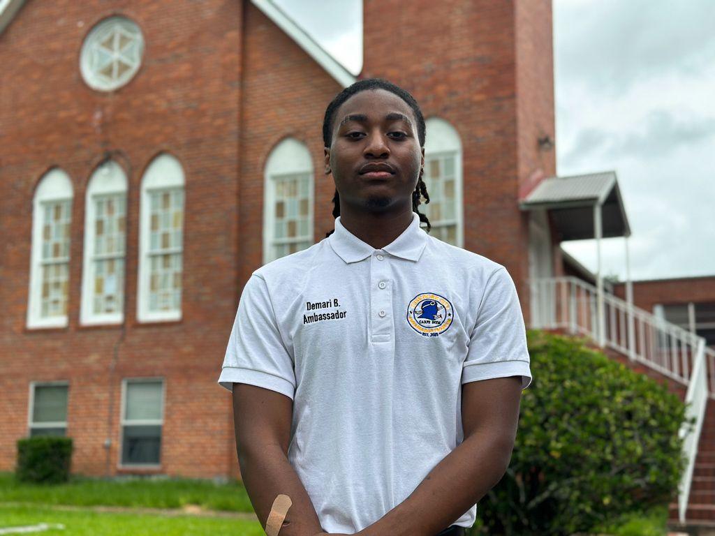 De'Mari Benham pictured with a bandage over a gaping wound on his arm.