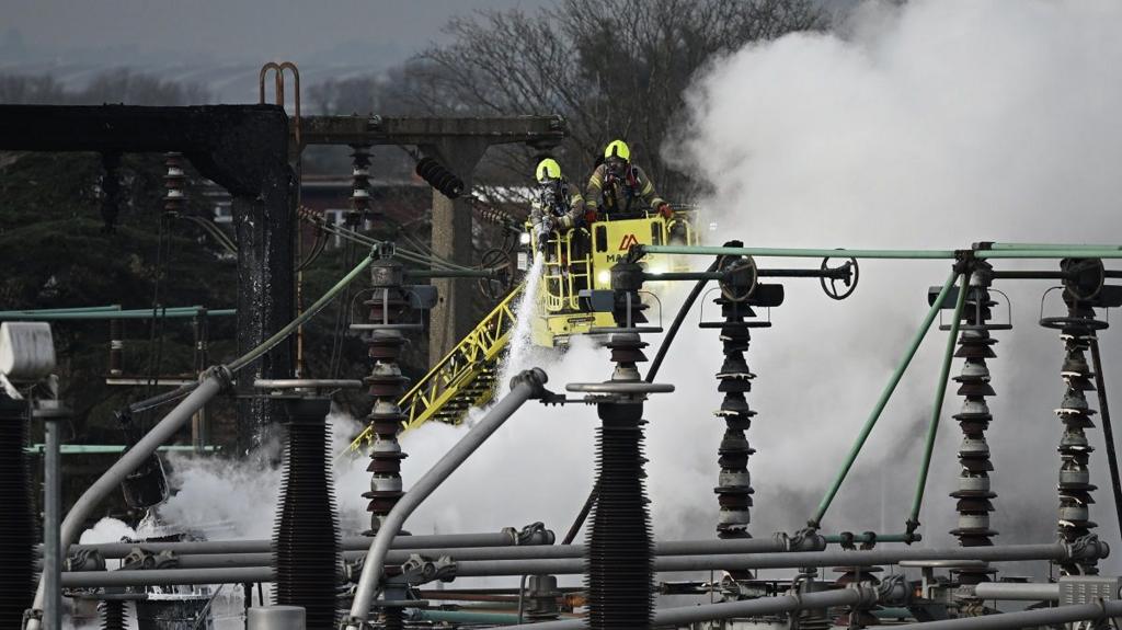 Firefighters douse flames at the substation