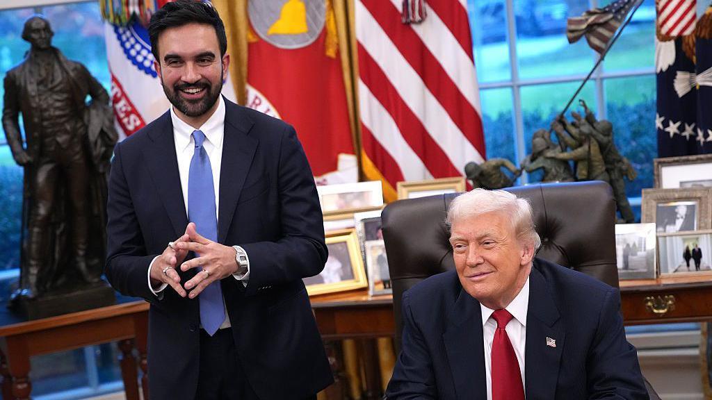President Donald Trump and New York City Mayor-Elect Zohran Mamdani smile as they take questions from the press in the Oval Office.