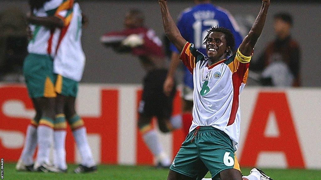 Aliou Cisse celebrates Senegal's shock 1-0 win over defending champions France in the opening game of the 2002 World Cup