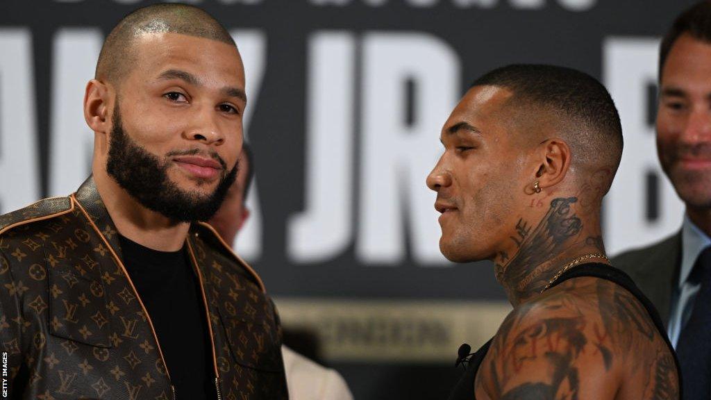 Chris Eubank and Conor Benn stand face to face during a media conference