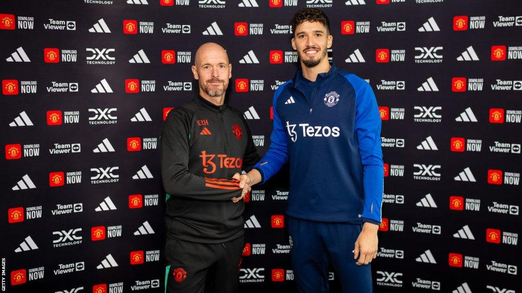 Altay Bayindir alongside manager Erik ten Hag after signing for Manchester United.