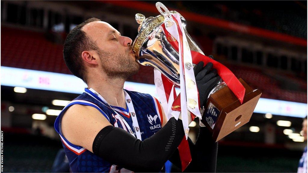 France's Jonathan Hivernat kisses the trophy