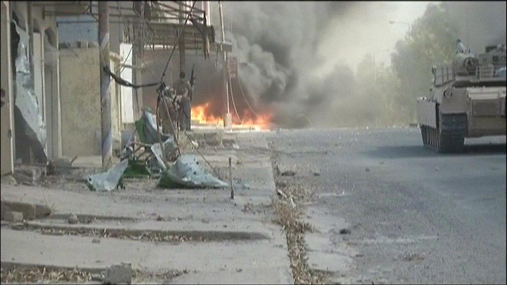 Iraqi forces move through the streets of Tal Afar