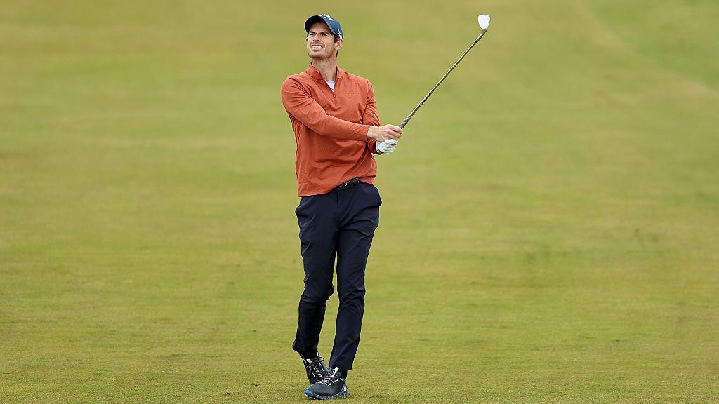 Andy Murray plays a shot from the fairway