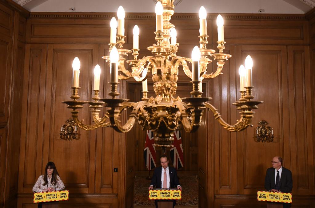 Susan Hopkins (left), Health Secretary Matt Hancock, and NHS England National Medical Director Stephen Powis holding a virtual news conference in Downing Street on 1 February 2021