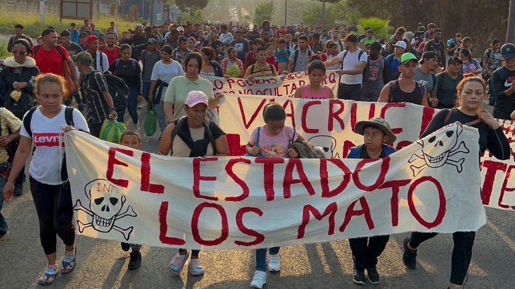 Migrants from Central and South America take part in a caravan attempting to reach the Mexico-US border, while carrying out a viacrucis to protest for the death of 40 migrants in a fire at a detention center in the northern city of Juarez, in Tapachula, Chiapas state, southern Mexico, on April 23, 2023.