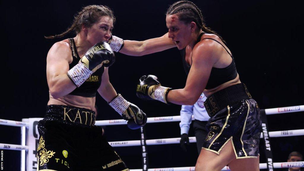 Katie Taylor is punched by Chantelle Cameron