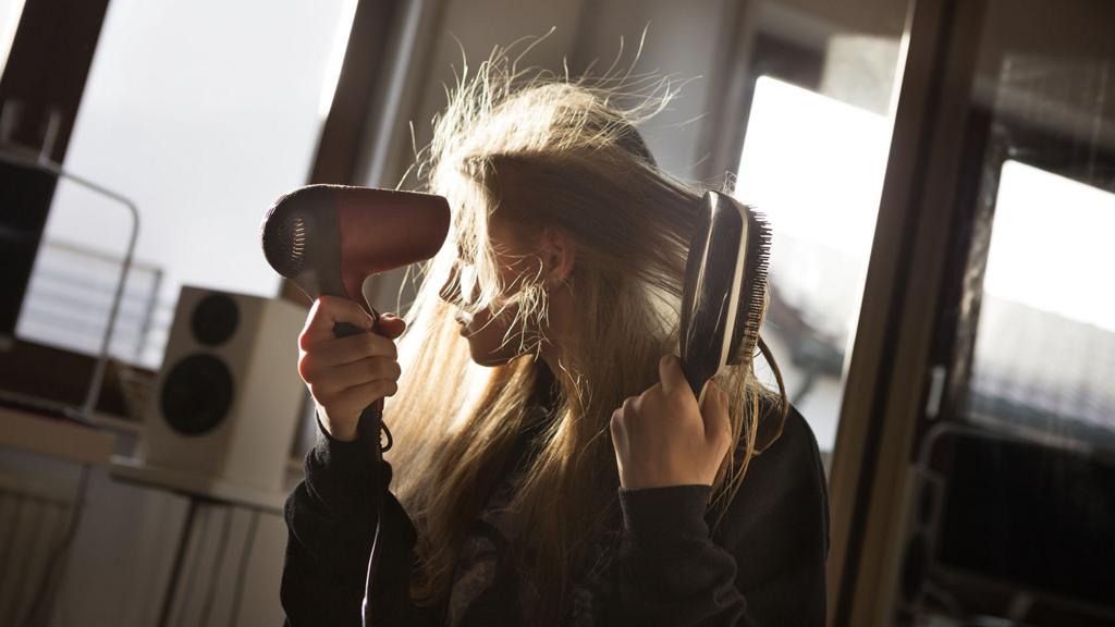 Woman drying her hair