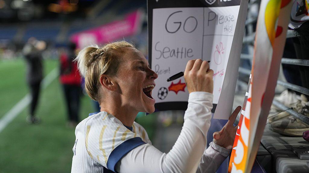 Jess Fishlock signing posters after an NWSL match between Seattle Reign and Bay FC.