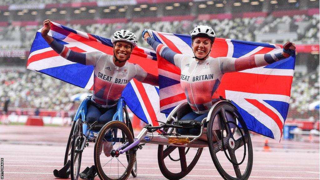 Hannah Cockroft (right) celebrates with team-mate Kare Adenegan after they won gold and silver respectively in the Women's T34 800m final in Tokyo