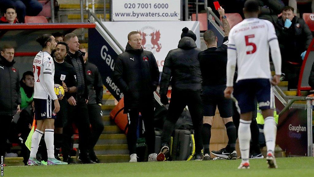 Referee Alex Chilowicz shows Leyton Orient head coach a red card at Brisbane Road