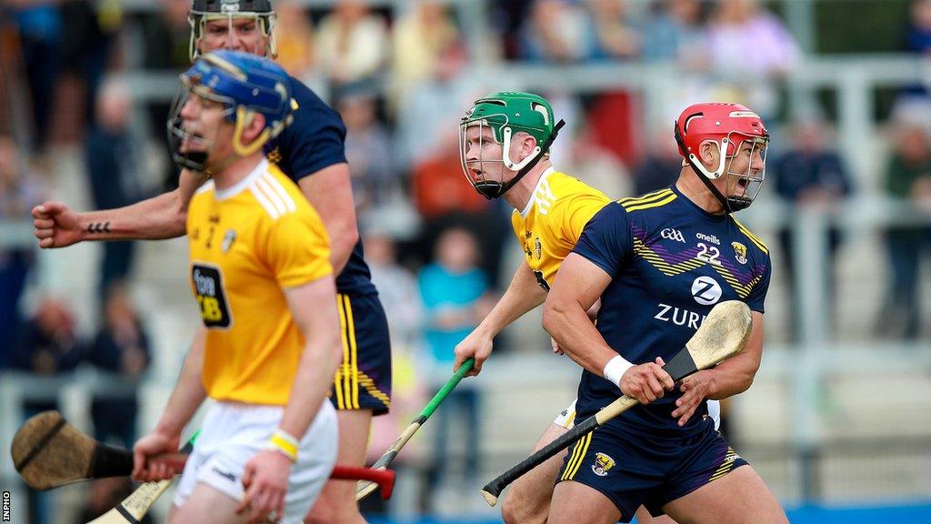 Lee Chin (right) celebrates a Wexford in the drawn 2021 League clash at Corrigan Park