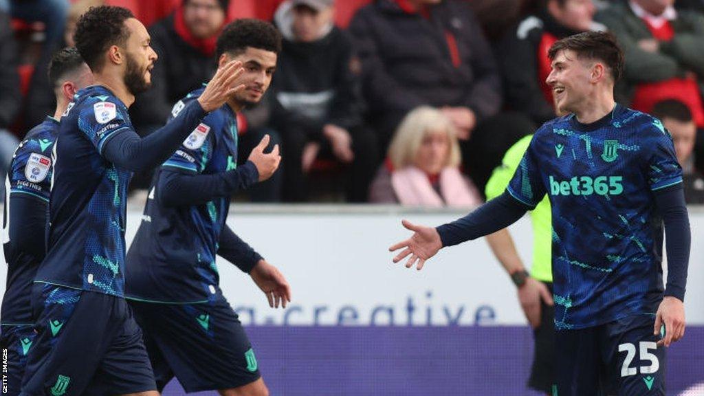 Stoke's Lewis Baker celebrates scoring with his team-mates