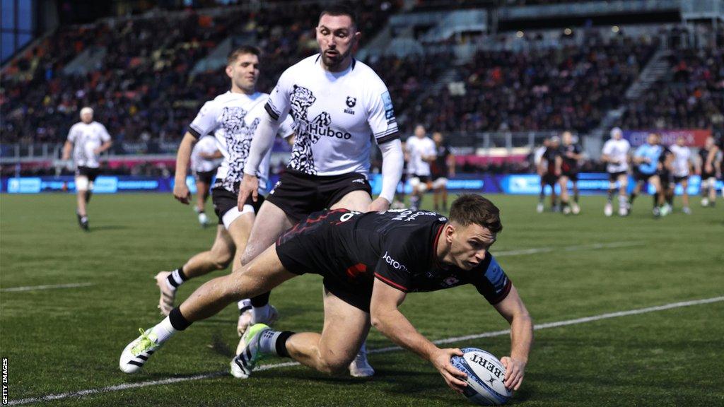 Alex Lewington touches the ball down for a try