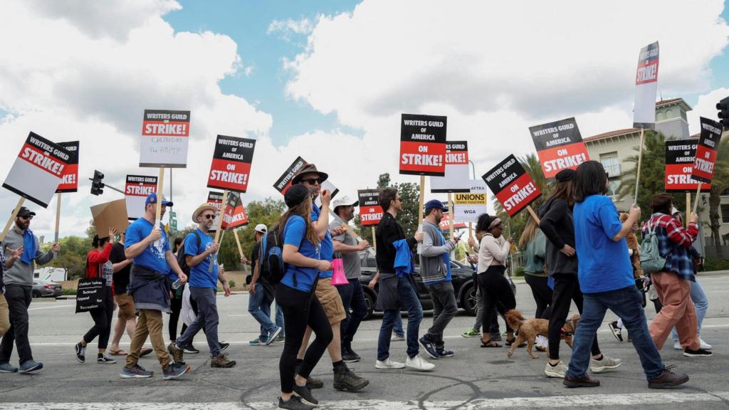 Workers and supporters of the Writers Guild of America protest outside Universal Studios Hollywood