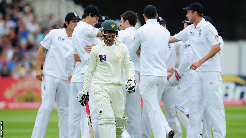 Salman Butt (middle) walks off the pitch after being dismissed v England