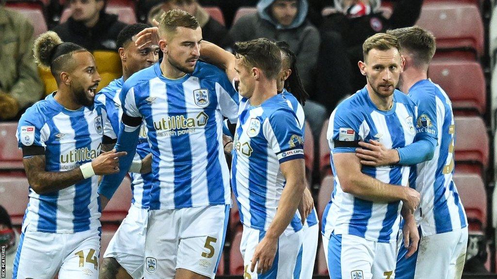 Huddersfield Town players celebrate a goal