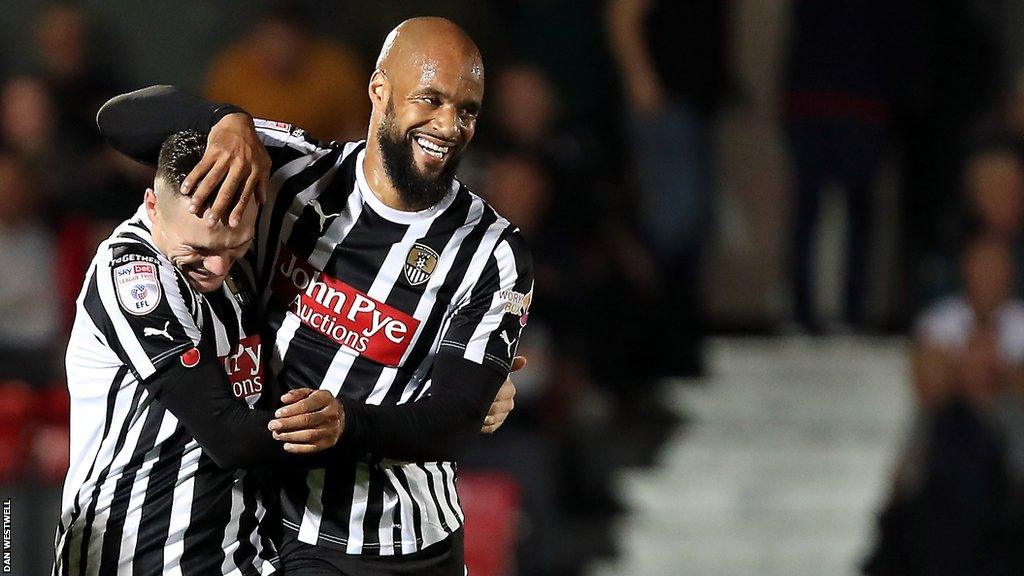 David McGoldrick (right) gets a hug from Notts County team-mate Macaulay Langstaff