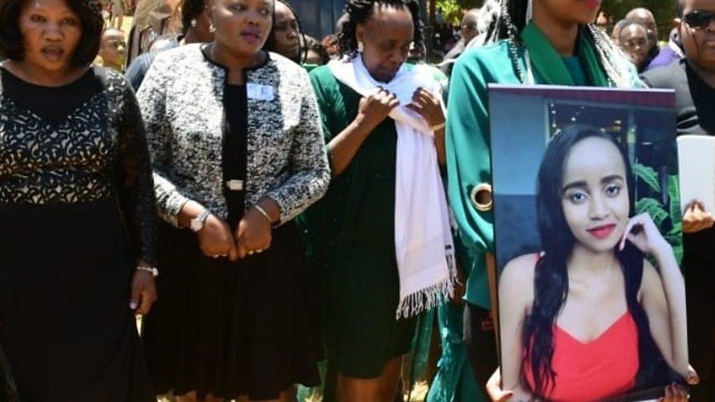 Large photo of Ivy Wangechi held up at her funeral