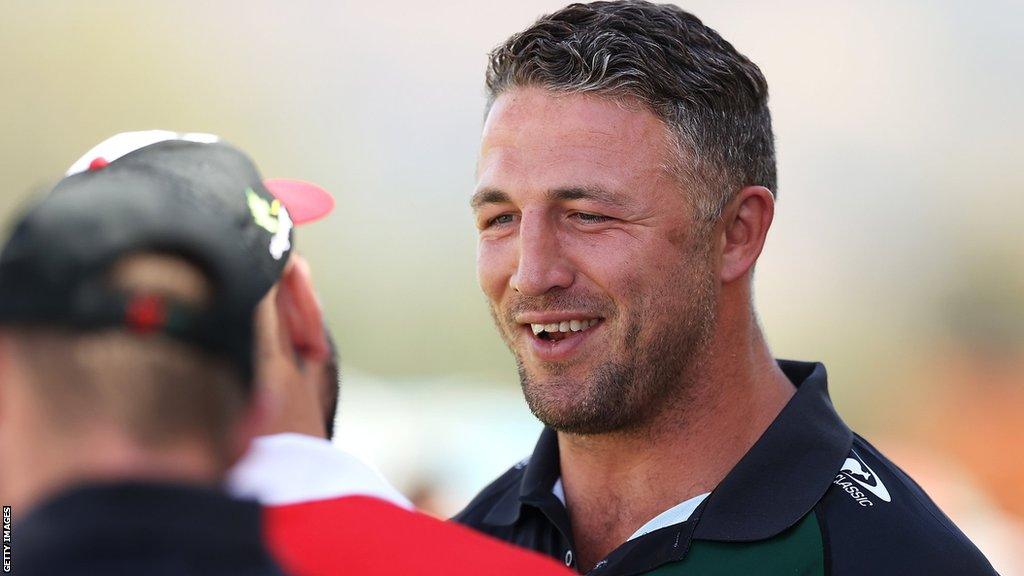 Sam Burgess smiles in conversation