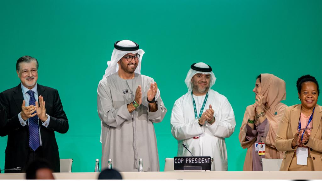 Members clap at COP28