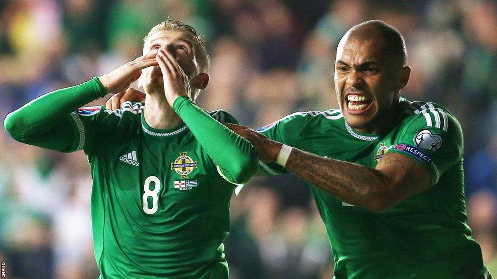 Josh Magennis celebrates with Steven Davis during the Euro 2016 qualifying win over Greece at Windsor Park in September 2015