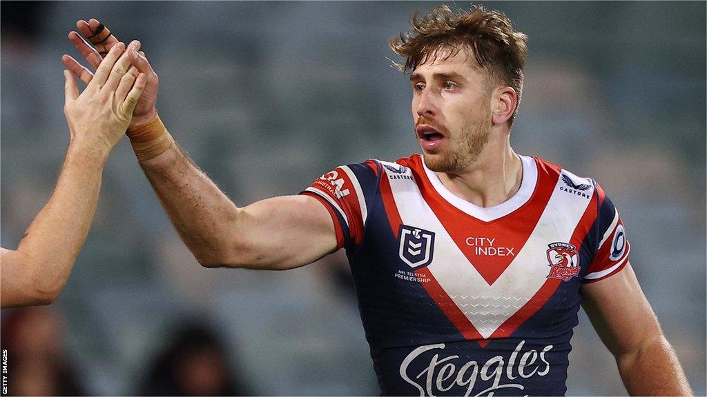 Paul Momirovski shakes Luke Keary's hand