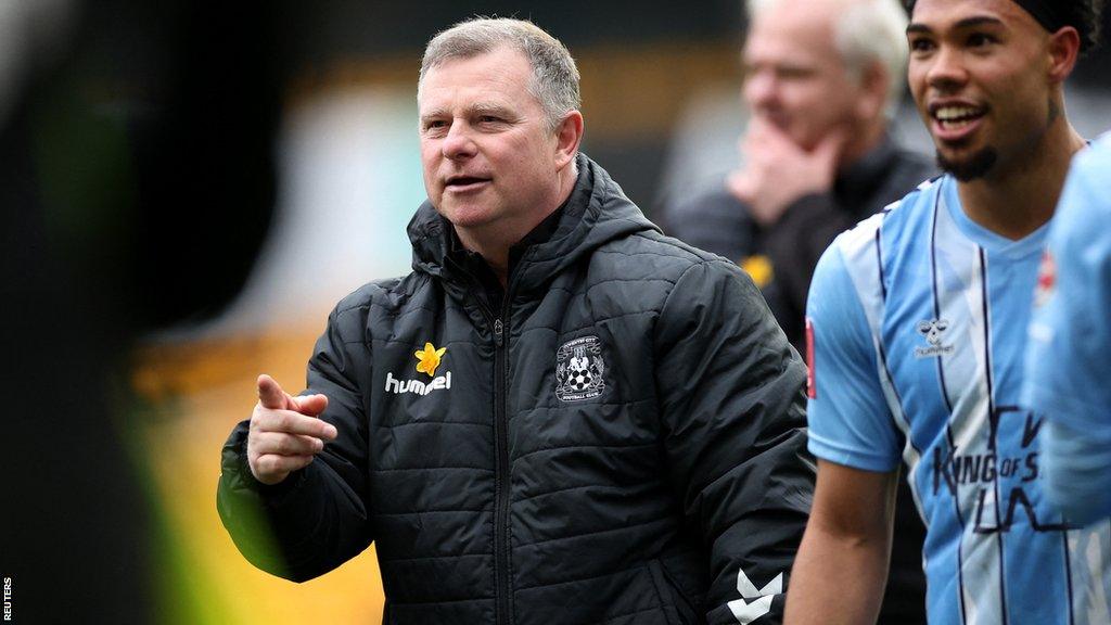 Mark Robins celebrates after Coventry beat Wolves