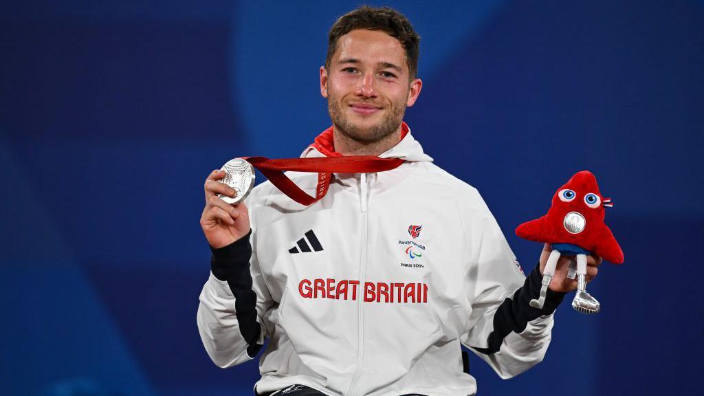 Alfie Hewett receives his men's singles silver medal at the Paris Paralympics